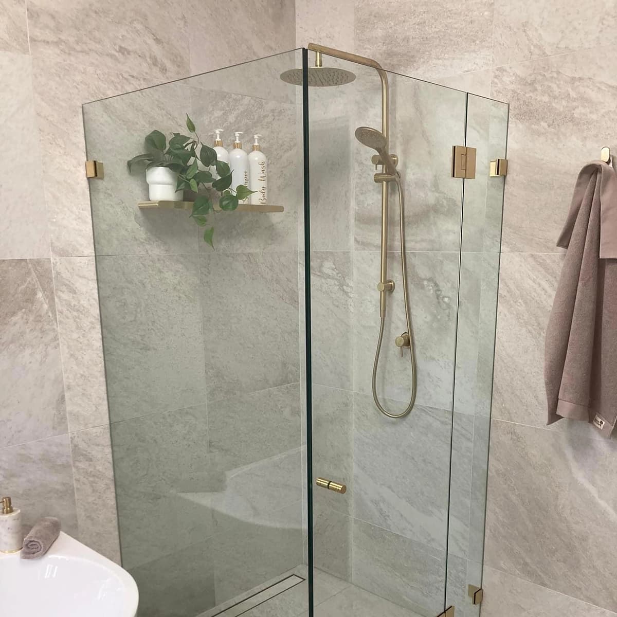 An expert glazier carefully installing a glass panel